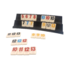 Het plankje met de stenen van Rummikub Anniversary Edition